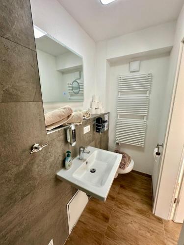 a bathroom with a sink and a mirror at INDIGO Luna in Ursensollen
