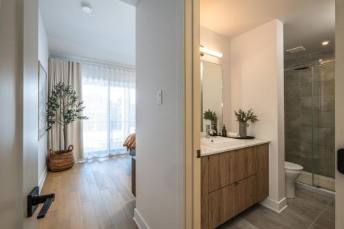 a bathroom with a sink and a toilet at Verbier 6-203 Family Luxury Retreat in Mont-Tremblant