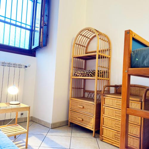 a room with a book shelf and a bunk bed at Vista Lago - Lake Como collection in Domaso