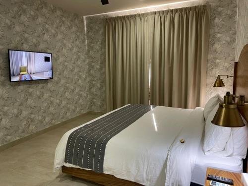 TV a/nebo společenská místnost v ubytování Casa Maria Boutique Hotel