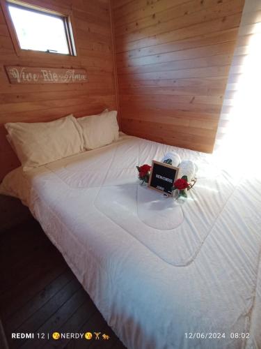a bedroom with a bed with a laptop on it at villas de la montaña, Tona, Berlin Santander in Tona