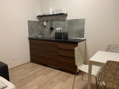 Кухня или мини-кухня в Residence Port Karolina
