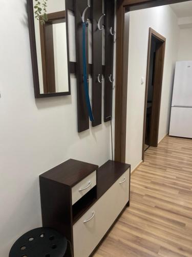 a room with a chest of drawers and a mirror at 7 people - 1 price - Cozy attic apartment in Prešov