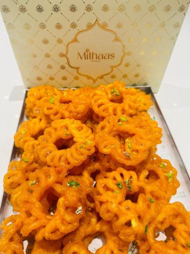 a pile of orange onion rings in a box at Hotel Gajraj in Gangtok