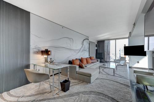 a living room with a couch and a table at The Lindo Cafaro Suite at Palms Place in Las Vegas