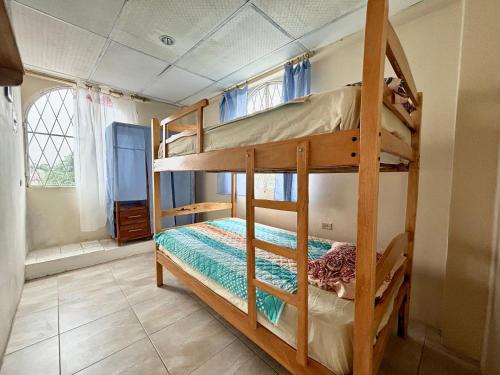 a bedroom with two bunk beds in a room at Las Casitas - Playas in Playas