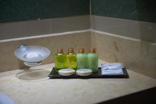 a group of four bottles sitting on top of a bathroom counter at Condado Hotel Casino Goya in Goya