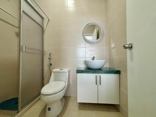 a bathroom with a toilet and a sink at Las Casitas - Milina in Salinas
