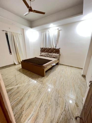 a room with a bed and a couch in it at luxurious farmhouse VILLA GRAND in Venkatāpur