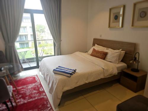 a bedroom with a bed and a large window at Modern Studio Oasis in Accra in Accra