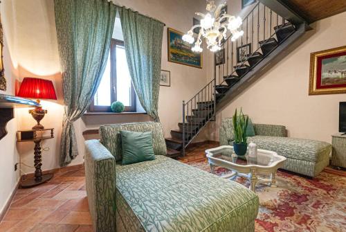 a living room with two couches and a table at Artist's Suites in Spoleto