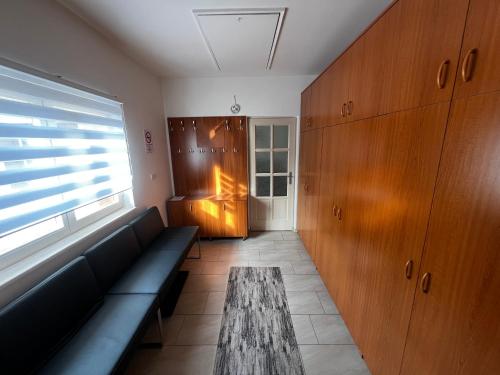 a living room with a couch and a table at Fortuna Apartman in Kőszeg