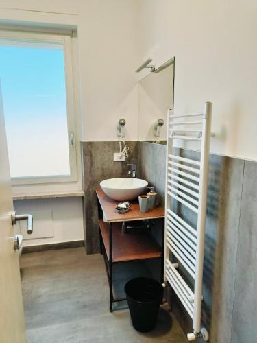a bathroom with a sink and a mirror at Villa Petra - Πέτρα in Alpignano