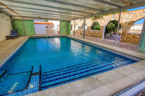 a large swimming pool in a building at Luxury Private Complex in Albir