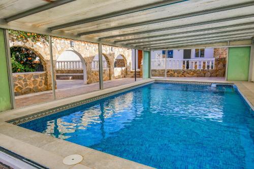 a large swimming pool in a building at Luxury Private Complex in Albir