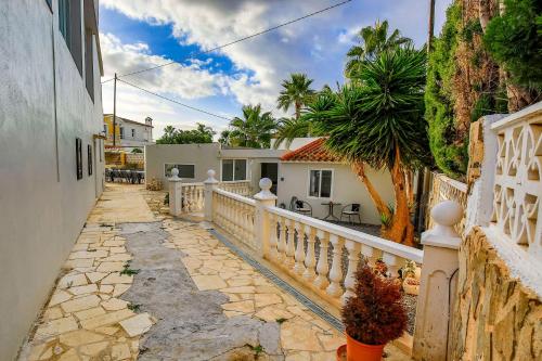 a house with a white fence and a walkway at Luxury Private Complex in Albir