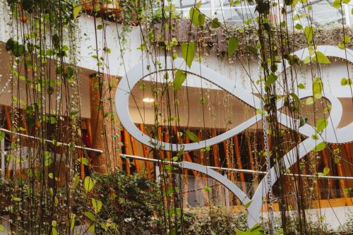 a building with vines growing on the side of it at Hacienda del Valle Sagrado in Urubamba