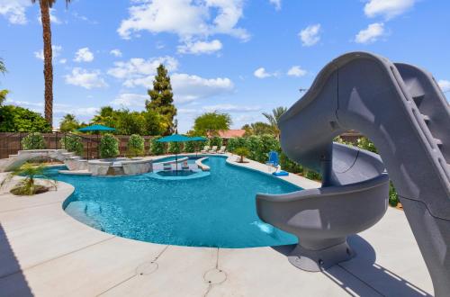 a slide in a pool at a resort at LAZY RIVER POOL , Water slide, Kids outdoor play area, Arcade games in Coachella
