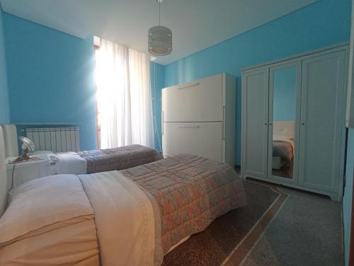 A bed or beds in a room at La casa sul mare-Savona