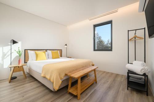 a bedroom with a bed and a window at Quinta da Amendoeira - Évora - The Farmhouse in Évora