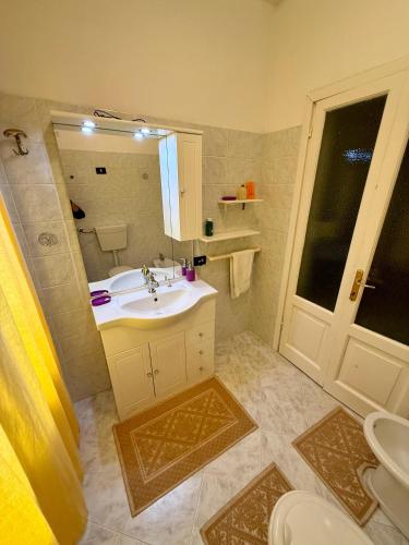 a bathroom with a sink and a mirror at Il Ronchetto in Sorso