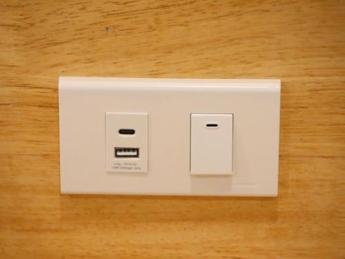 a white light switch sitting on top of a table at Moya Boutique Hotel in Betong