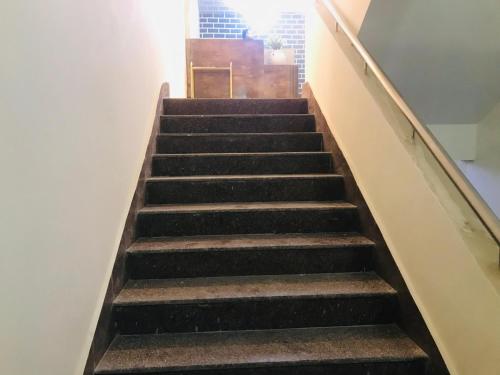 a set of stairs in a building at Aquila Hotel and Convention by The Nexus in Patna