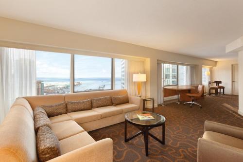 a living room filled with furniture and a large window at Swissotel Chicago in Chicago