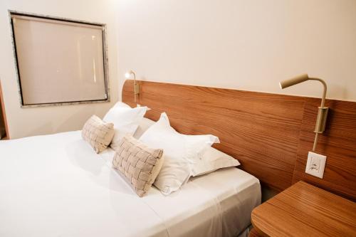 Ένα ή περισσότερα κρεβάτια σε δωμάτιο στο Hotel Sonata de Iracema