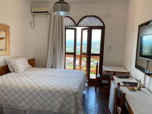 Postel nebo postele na pokoji v ubytování Hotel Serra do Ouro