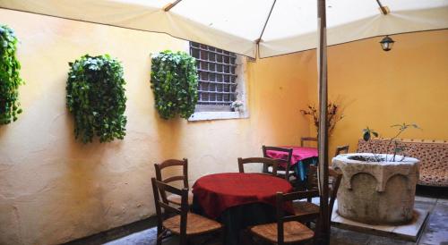 a patio with a table and chairs and an umbrella at Best Holidays Venice in Venice