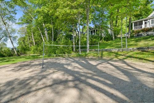 a net on a dirt road in front of a house at The Jackrabbit - 3 Summer Village in Cherry Valley