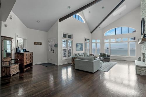 a large living room with white walls and wood floors at Lake Shore Living in Michiana