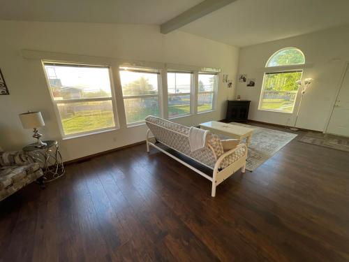 a living room with a couch and a table at Rosie's Surf Shack in Aberdeen