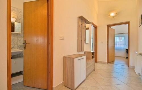a room with a kitchen with a sink and a door at HOUSE Nevenka in Nova Vas