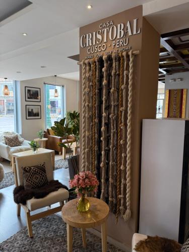 a store with a sign that says christchurcholean perry at CASA CRISTOBAL Centenario in Cusco