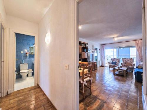 a living room with a table and a dining room at Las Nuevas Sirenas en La Manga in La Manga del Mar Menor