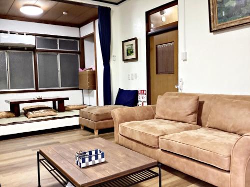 a living room with a couch and a table at Tokami House - Vacation STAY 21218v in Yasugi
