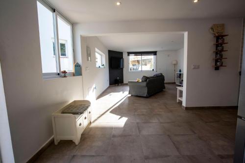 a living room with a couch and a window at Open and large 1 bed apartment in L'Alfas del Pi