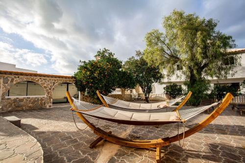 a hammock on display in a courtyard at Open and large 1 bed apartment in L'Alfas del Pi