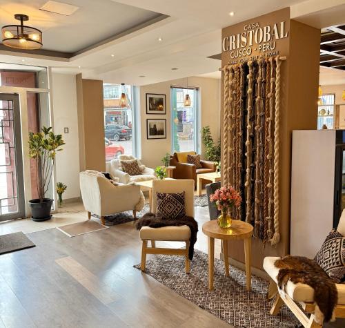 a lobby with couches and chairs in a store at CASA CRISTOBAL Centenario in Cusco