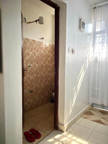 Koupelna v ubytování Cozy studio Milimani