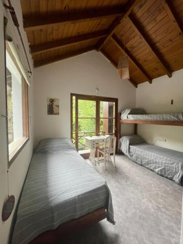 En eller flere senge i et værelse på Casa Bere