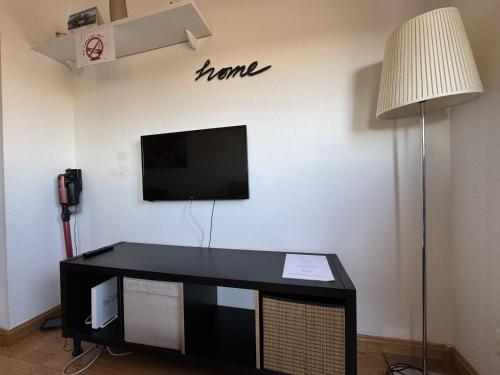 Et tv og/eller underholdning på Casa con piscina