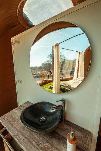 a bathroom with a black sink and a mirror at Hotel Rural La Correa del Almendro & Bubble Experience - Adults Only in Arona