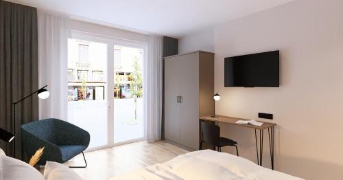a hotel room with a bed and a desk and a television at Brera Serviced Apartments Böblingen Sindelfingen in Böblingen