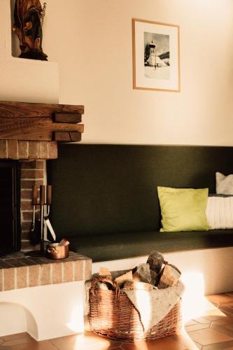 a living room with a couch and a fireplace at Tanafreida Berg-Refugium in Sankt Gallenkirch