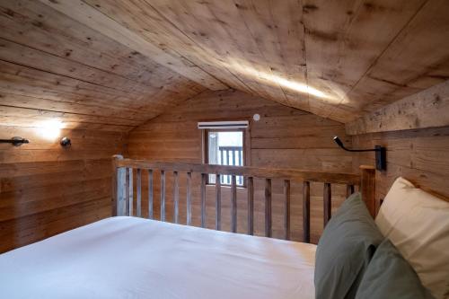 a bedroom with a bed in a cabin at La ferme d'Hauteluce - Chalets in Hauteluce