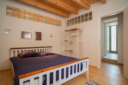 a bedroom with a large bed in a room at Neapolis Oasis - Lower House in Neapolis