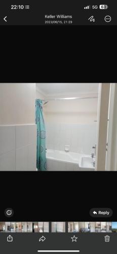 a picture of a bathroom with a bath tub at 2 Bedroom Willow Park Apartment in Ballito